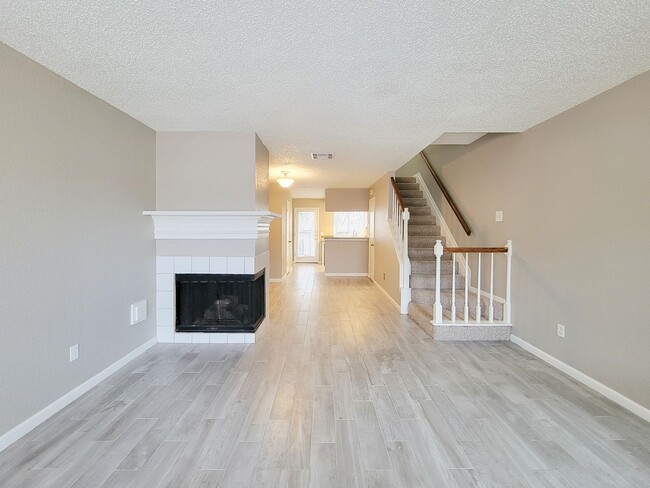 Building Photo - Welcome to This Charming Townhome Nestled ...
