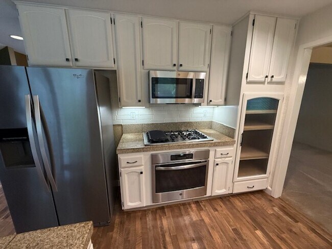Building Photo - Private Redwood Setting | 4BR Home with Family Room, Bar & Garage Workspace - Available Now