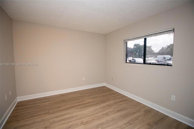 Building Photo - 9491 Palm Cir S