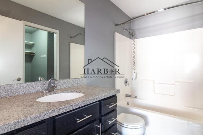 Building Photo - Updated 4 Bedroom Home with Remodeled Kitchen & Tiered Deck