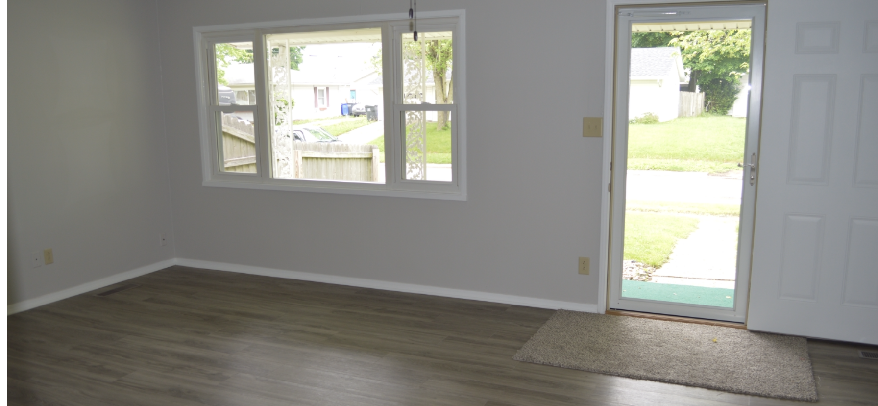 Neutral paint throughout with new flooring - 2827 N Waugh St