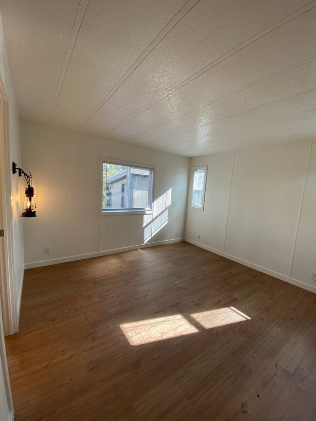 Building Photo - Beautifully just Remodeled-Spacious 3 bedrooms, 2 full baths mobile home with fenced yard. storag...
