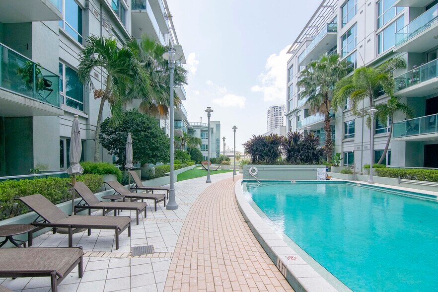 Pool deck and hot tub, adjacent to fitness center and sauna - 111 N 12th St