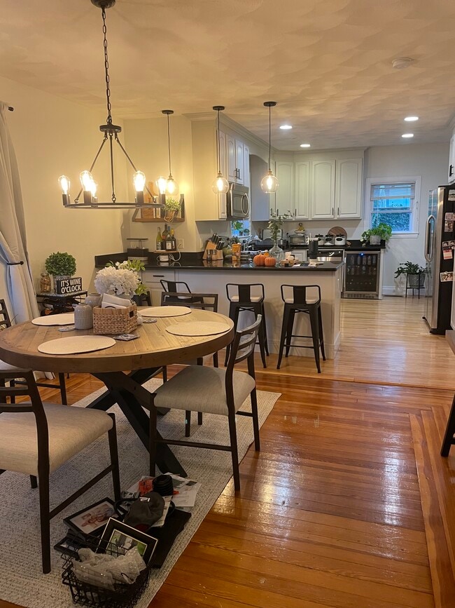 Dining room & kitchen, featuring new light fixtures - 20 Princeton St
