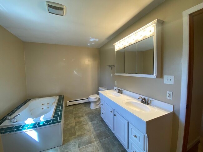Building Photo - Beautiful secluded 4 bedroom 2.5 bath home with 2 stall detached garage and descent sized yard