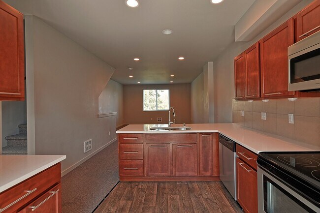 Building Photo - Move in Ready! Spacious 3 bedroom, 2.5 bath Townhome with small fenced backyard, located in sough...
