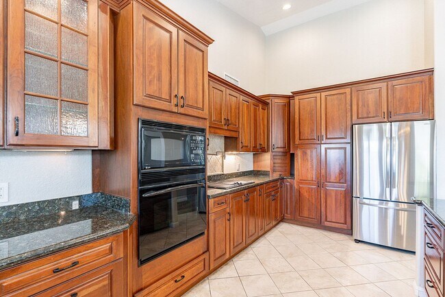 Building Photo - Charming 4-Bedroom Home with Luxurious Poo...