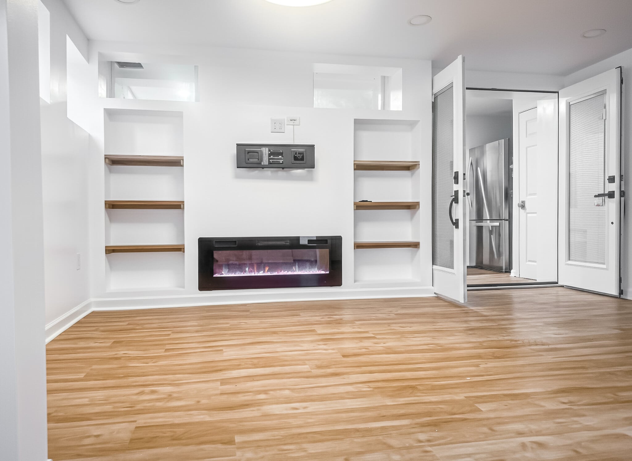 pacious multi-purpose room with fireplace and French doors (2025 addition) - 6471 Grommet Dr