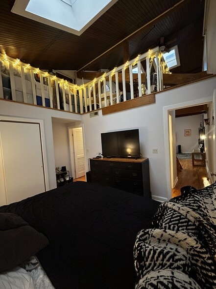 bedroom with a view of the loft upstairs - 134 Washington St