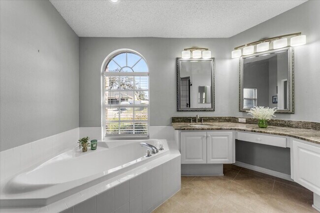 Building Photo - A vibrant 2-bedroom, 2-bathroom tropical retreat designed for both high-energy entertaining and l...