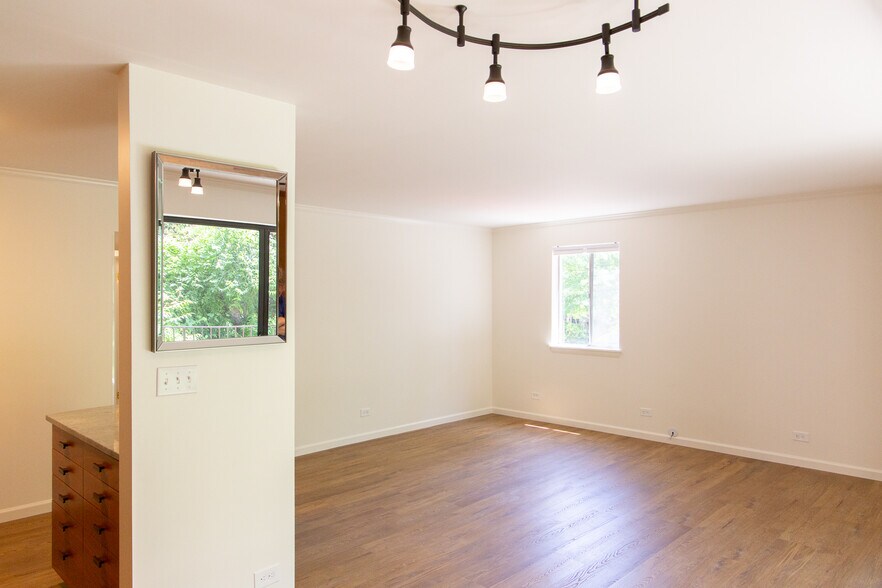 View from the kitchen, past the dinning area, into the living room - 511 1st St N