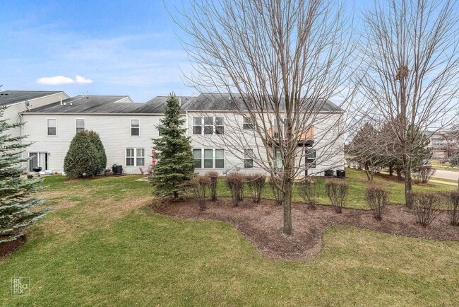 Building Photo - AUTUMN CREEK SECOND FLOOR CONDO WITH TWO CAR GARAGE