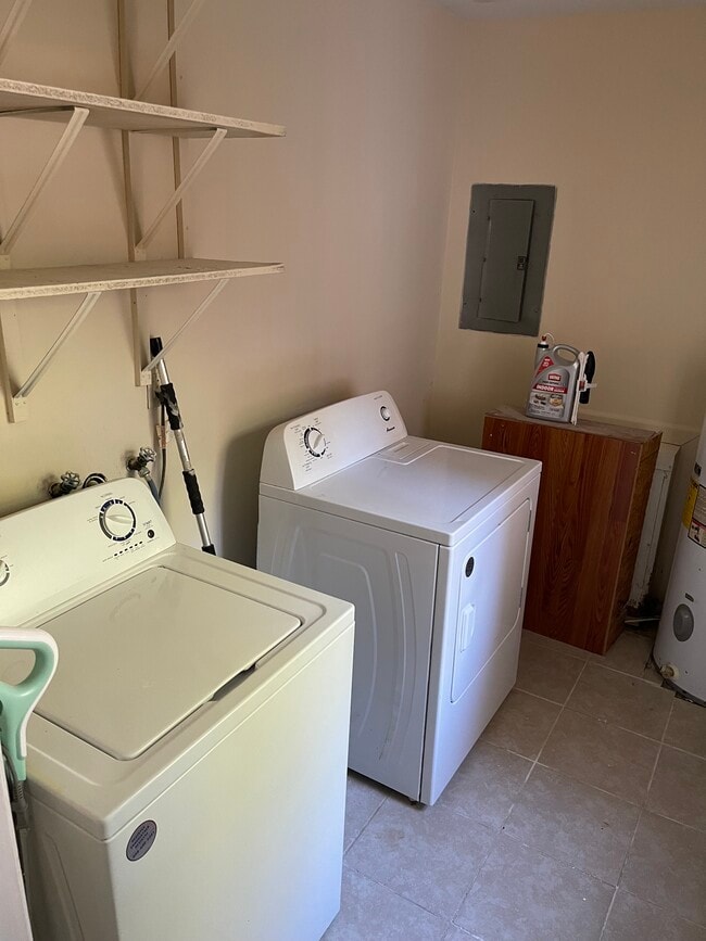 Laundry room with storage - 221 Bailiff Ct