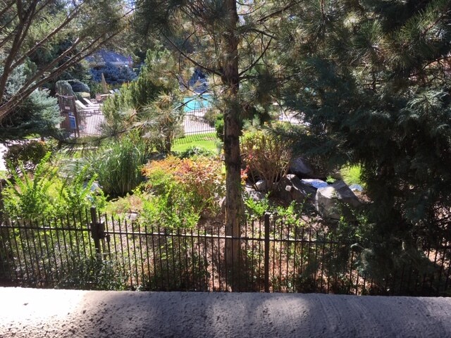 Peak view of pool off balcony - 900 S Meadows Pky