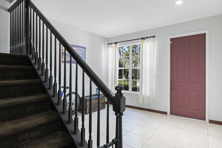 Stairs to bedrooms - 9945 E Villa Cir