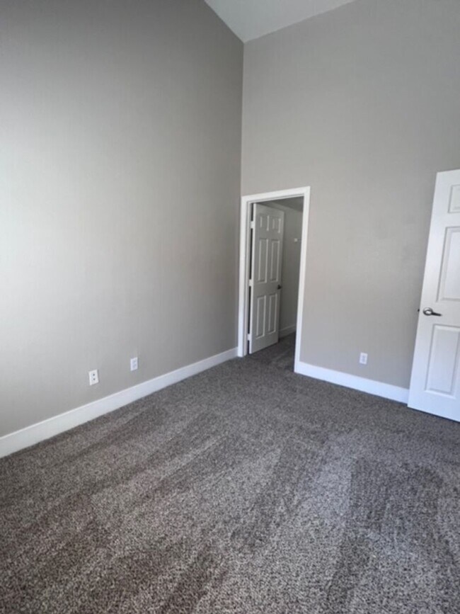 Building Photo - Three bedroom townhouse with 2 car garage