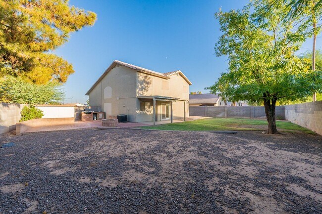 Building Photo - Spacious 5-Bedroom Home with Open Layout & Private Backyard