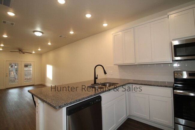 Building Photo - Upscale Four-Bedroom Townhome!