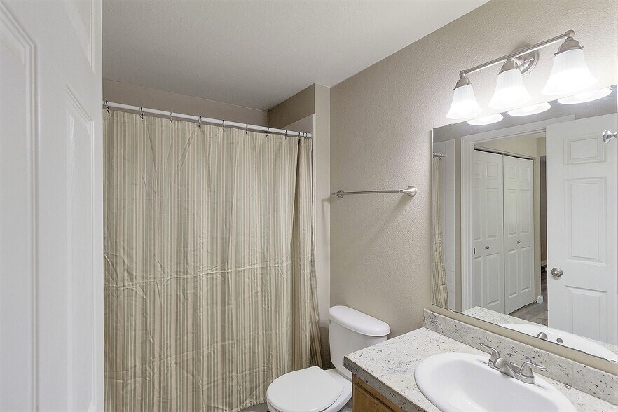 Full bath with entries from either bedroom or living room hallway - 10026 NE 127th Pl