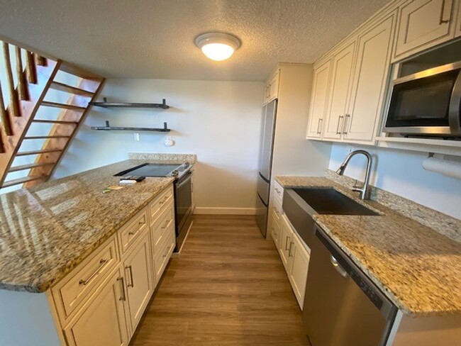 Building Photo - Year Lease 3 bedroom unit with Carport and...