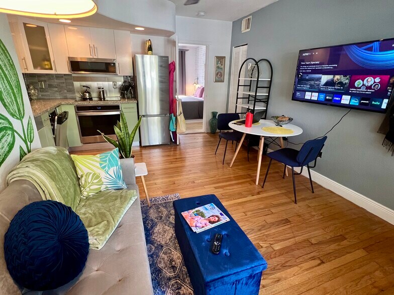 Living room with sofa sleeper and view of kitchen and dining table - 901 Euclid Ave
