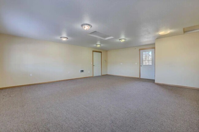 Building Photo - 1/2 acre in the with RV Hook ups