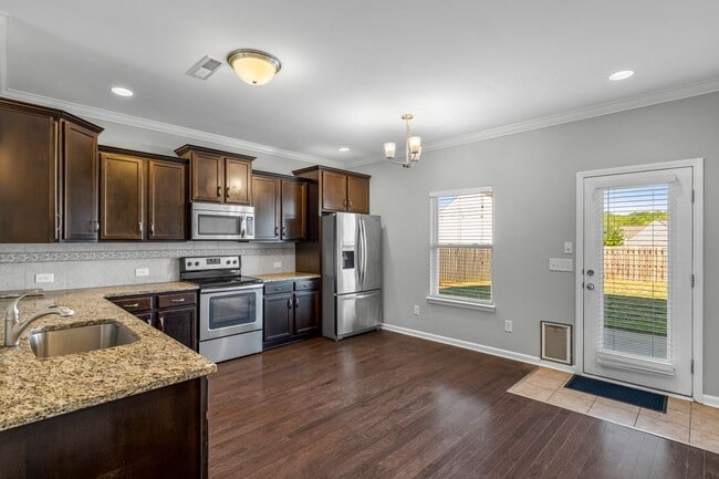 Building Photo - Newer Home, Granite Counter-Tops, Wood Laminate Flooring, SS Appliances, Garage, Fenced, Must See!