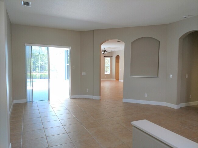 Building Photo - Annual Rental: Luxurious 4 Bedroom 3 bath POOL home in Woodlands of Rivendell! Just Blocks form P...