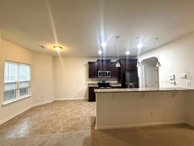 Building Photo - Spacious 4BR Home with Large Fenced Yard & Prime Location