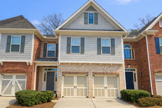 Building Photo - Gated Johns Creek Townhome Offering Space, Privacy, and Everyday Convenience