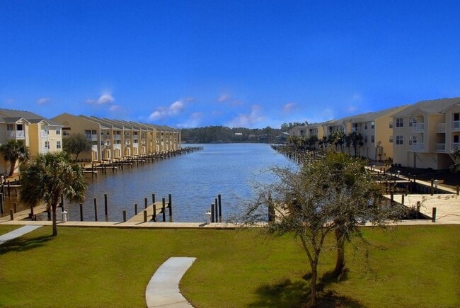 Building Photo - WATERFRONT LIVING! BEAUTIFULLY APPOINTED CONDO ON THE BAYOU IN OS SCHOOL DIST - FULLY FURNISHED