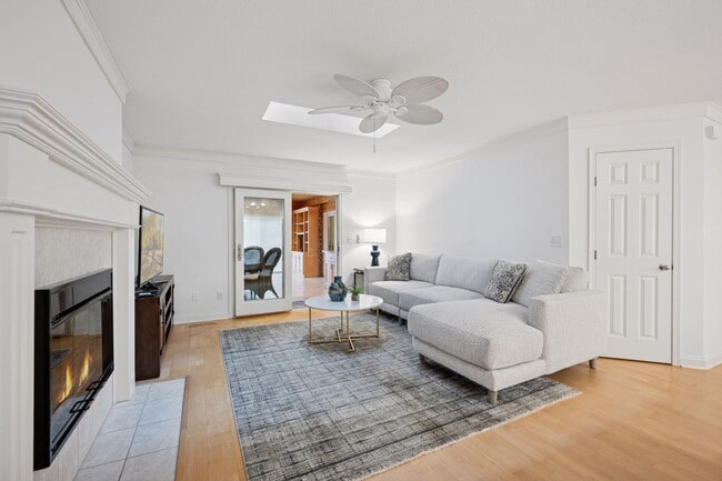 Informal living room with access to the year-round sun room - 145 Holly Ln N