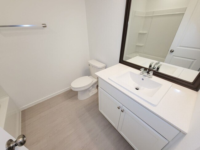 Building Photo - This single-level home showcases a spacious open floorplan shared between the kitchen, dining are...