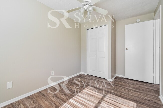 Building Photo - The living is easy in this 4 bedroom, 2 ba...