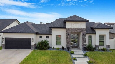 Building Photo - "Luxurious 4-Bed Oasis with Pool & 3.5 Baths in McAllen's Prime Locale!"