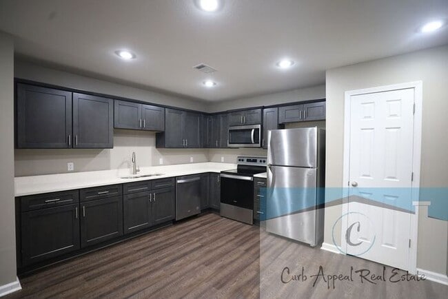 Building Photo - Move in special $800!! Luxury 2 bed, 1 bath duplex - new construction!! Washer, dryer, utilities ...