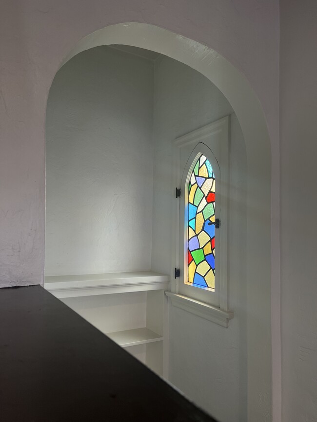 Stained glass arched window - 1614 Cimarron St