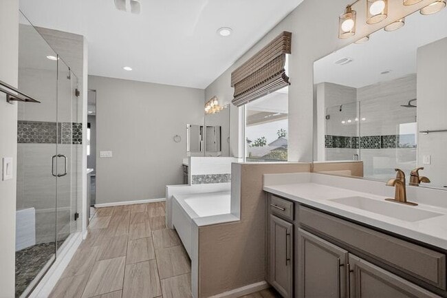 Building Photo - Stunning 5 Bed/5Bath Home in Gated Community – Over 3,100 SqFt of Modern Living -New Carpet throu...