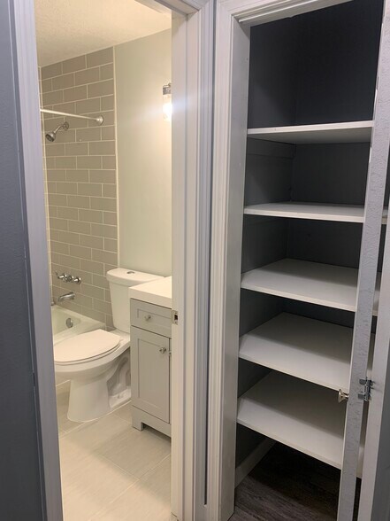 Lots of storage outside of bathroom - 4820 Park Commons Dr