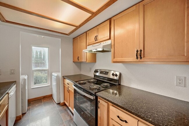 Building Photo - AVAILABLE NOW! 2BR/2BA Condo – Awesome Location! Glossy Hardwoods, Granite Countertops, W/S/G Inc...