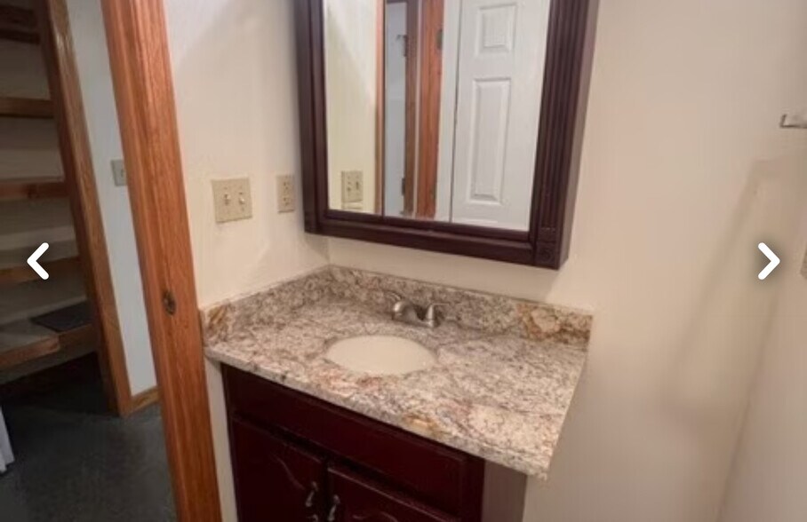 Bathroom with cherry medicine cabinet and matching vanity with granite top and Kohler cast iron cer - 26 Rochester St
