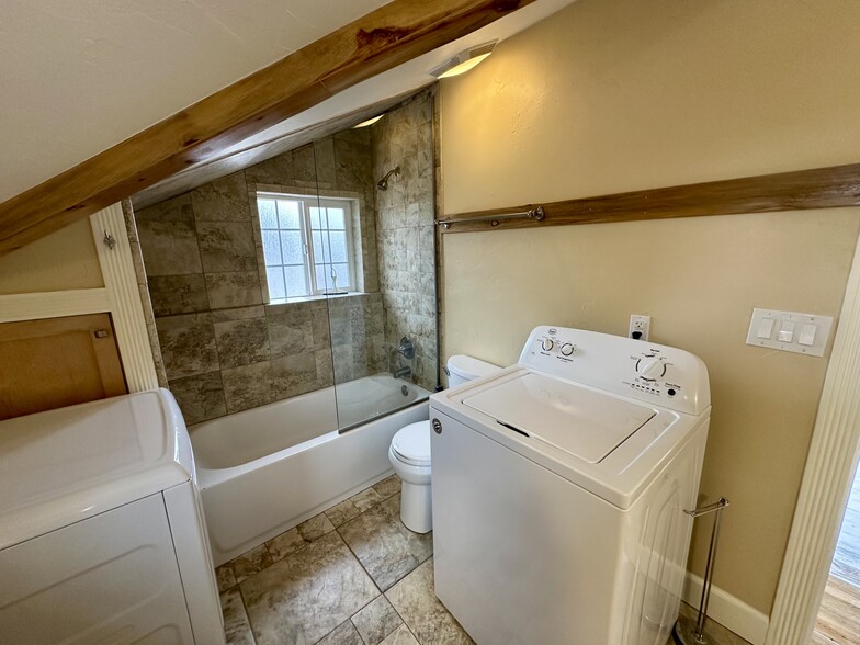 Washer and dryer within bathroom for convenience. - 812 E Cache La Poudre St