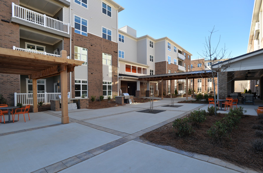 A beautiful courtyard links the 2 buildings. - MainStreet Breckinridge | 62+ Active Adults