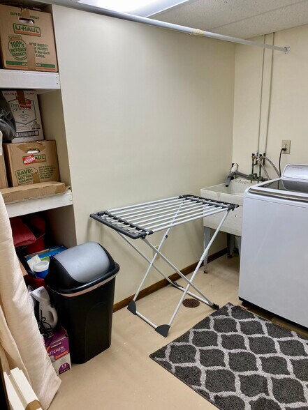 Laundry room w build in storage on left - 16 Kyles Ln