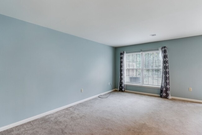 Building Photo - Three bedroom two and a half bathroom town...