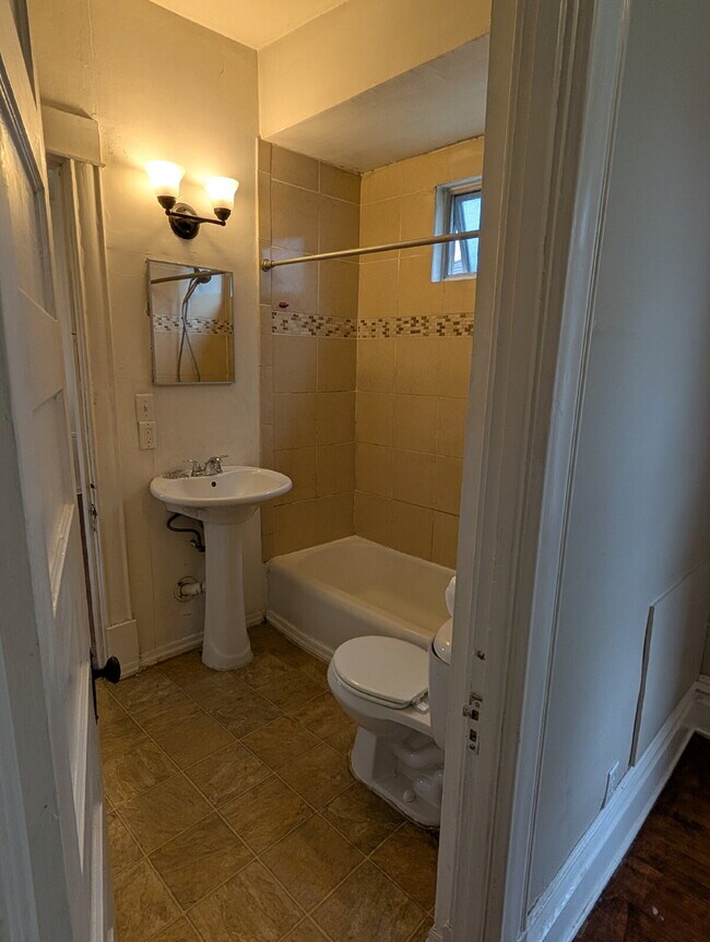 Building Photo - Bright & Charming 3BR With Garage Included In NE Minneapolis