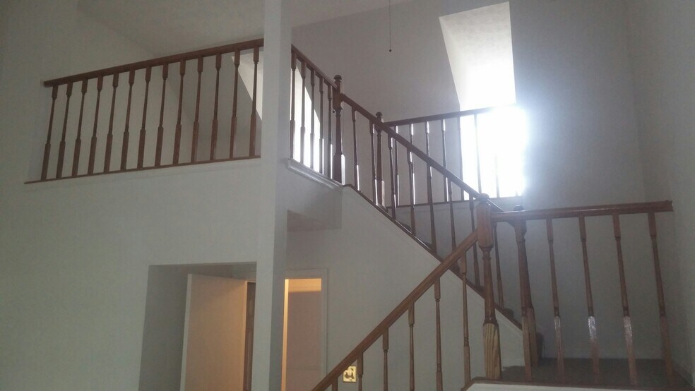 Staircase showing loft in Primary Bedroom - 7722 Wolford Way