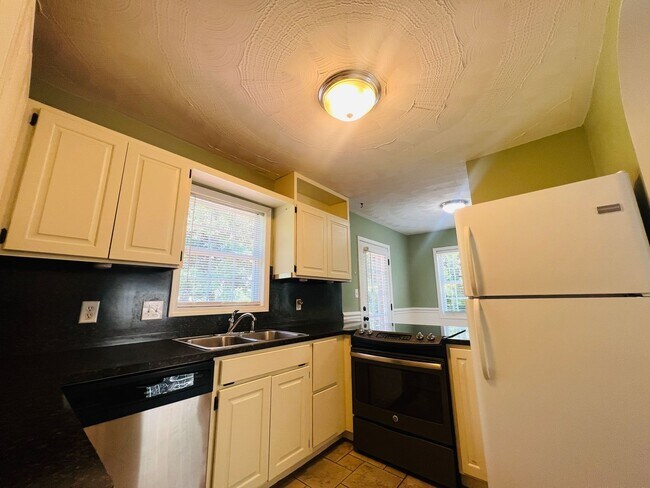 Building Photo - Unit is no longer available - application approved.  Charming 1 1/2 story brick home with basemen...