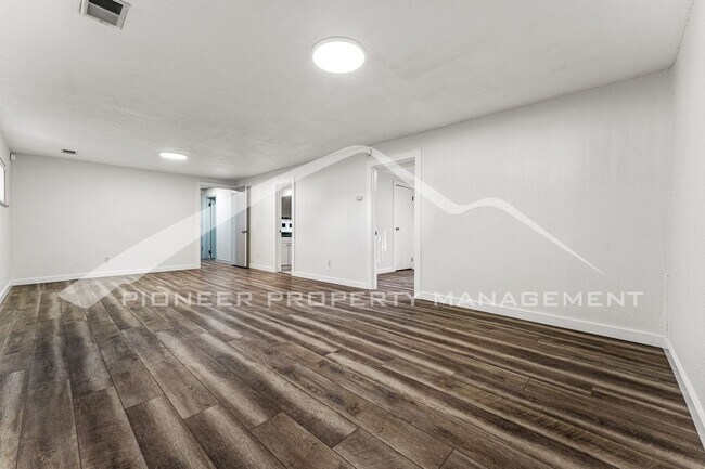 Building Photo - Spacious Home with Natural Light & Fenced Backyard