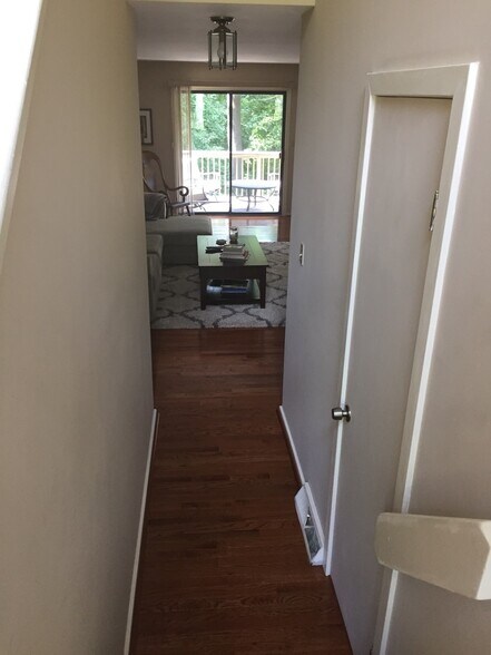 Hallway from front entrance to living room area, powder room on right - 443 Lynetree Dr